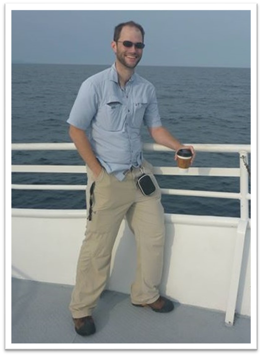 A person standing on a boat

Description automatically generated with medium confidence
